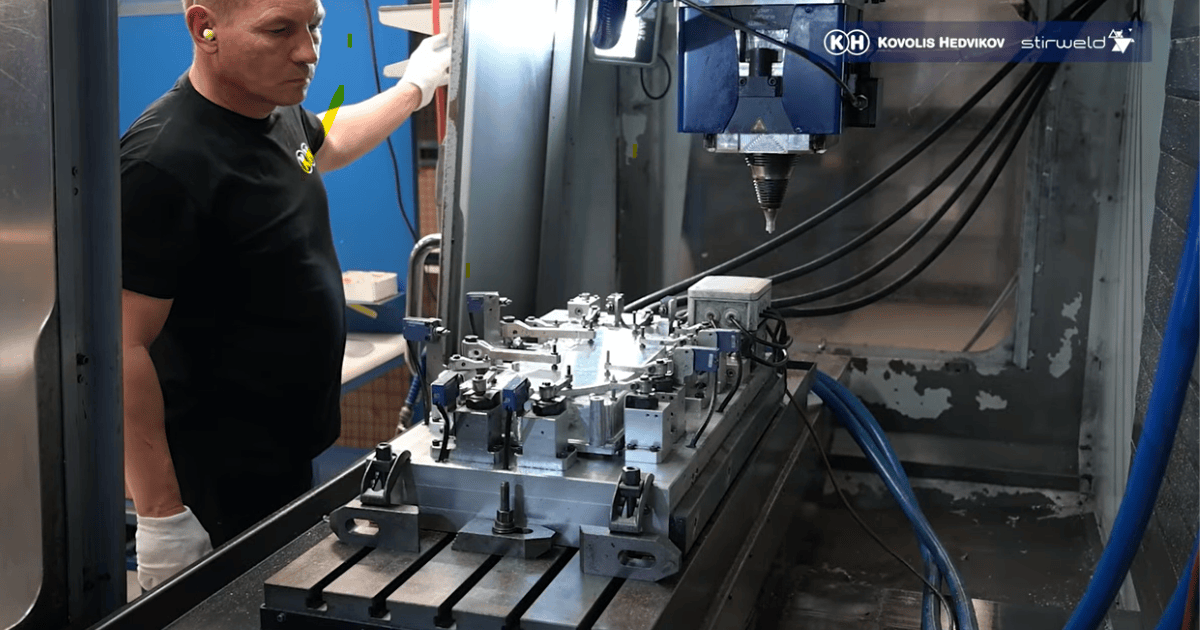 An operator loads the cooling housing into a HAAS machining center equipped with Stirweld’s standard FSW head.
